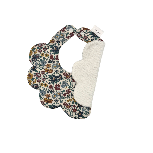 Floral scalloped baby bib in neutral tones, Annabella Neutral, close-up of the print