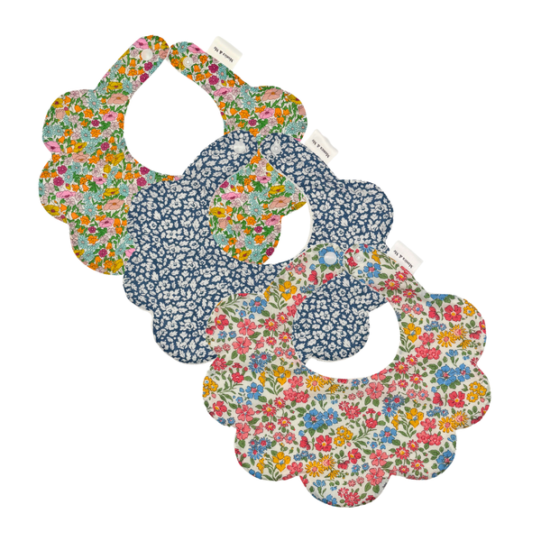 Annabella Set of three Liberty print scalloped baby bibs, flat lay