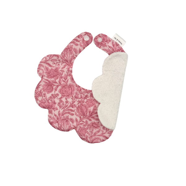 Pink Liberty floral scalloped baby bib, Pomegranate Pink, close-up of the print