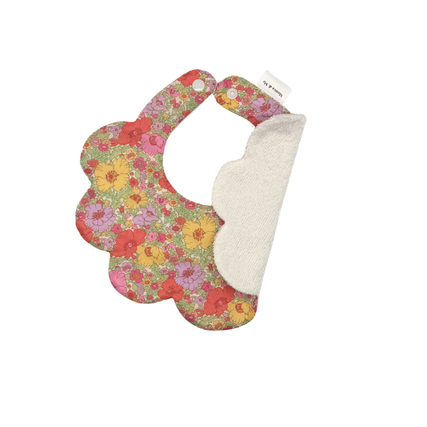 Pink, yellow, orange and lilac Liberty floral scalloped baby bib, Meadow, close-up of the print