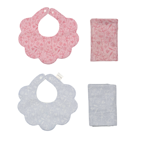 Tulip print pink and blue scalloped bibs and matching muslin squares, flat lay